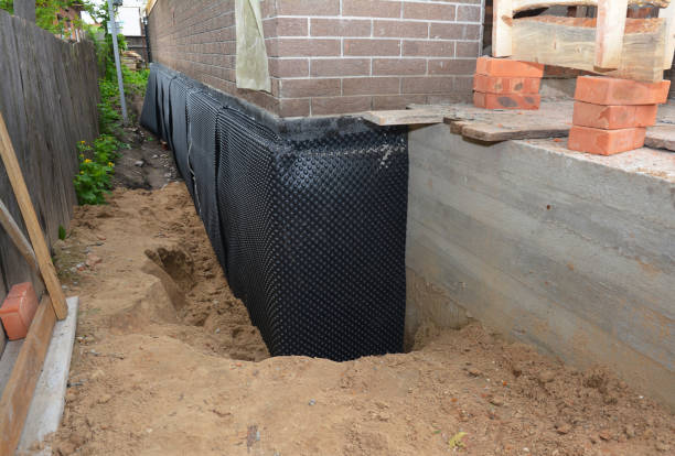 Happy homeowners after waterproofing job in Gasport